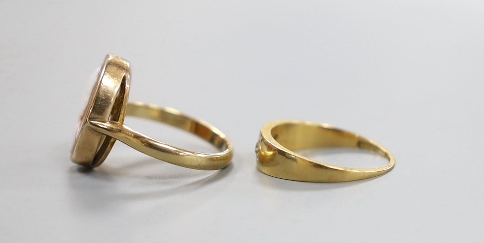 An 18ct and two stone gypsy set diamond ring, gross 2.6 grams and a 9ct gold cameo portrait ring, gross 3.3 grams.